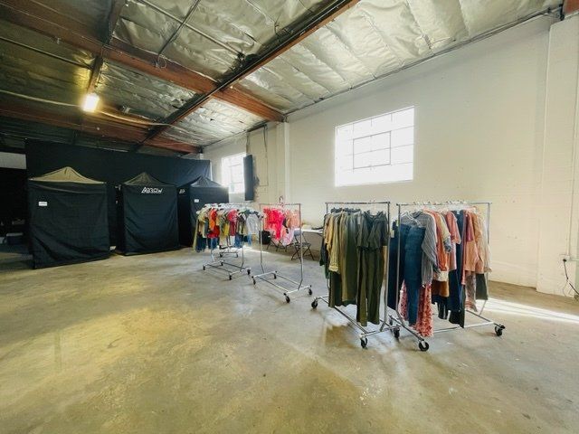 Racks of clothes in a studio