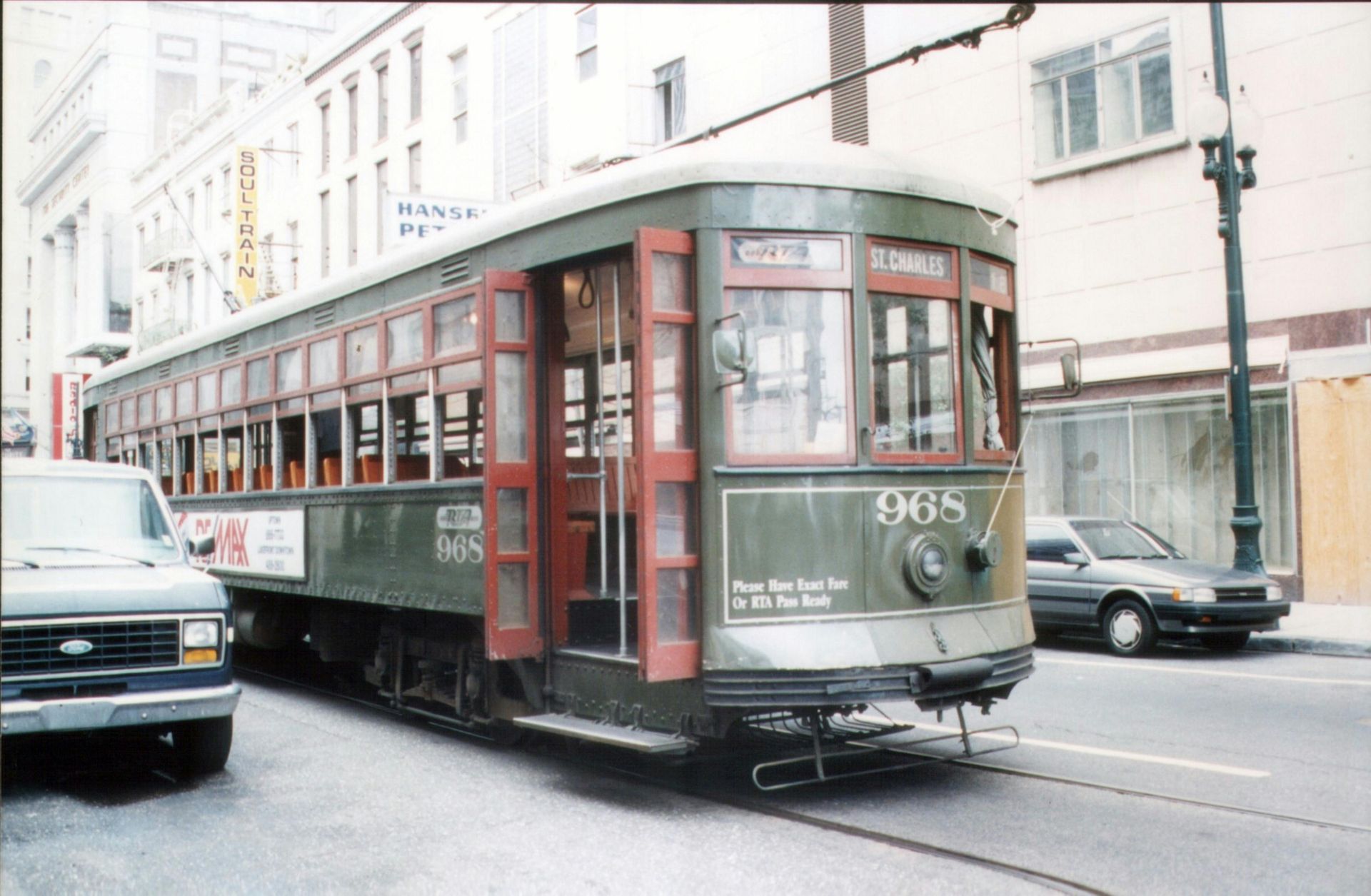 A green trolley with the number 965 on it