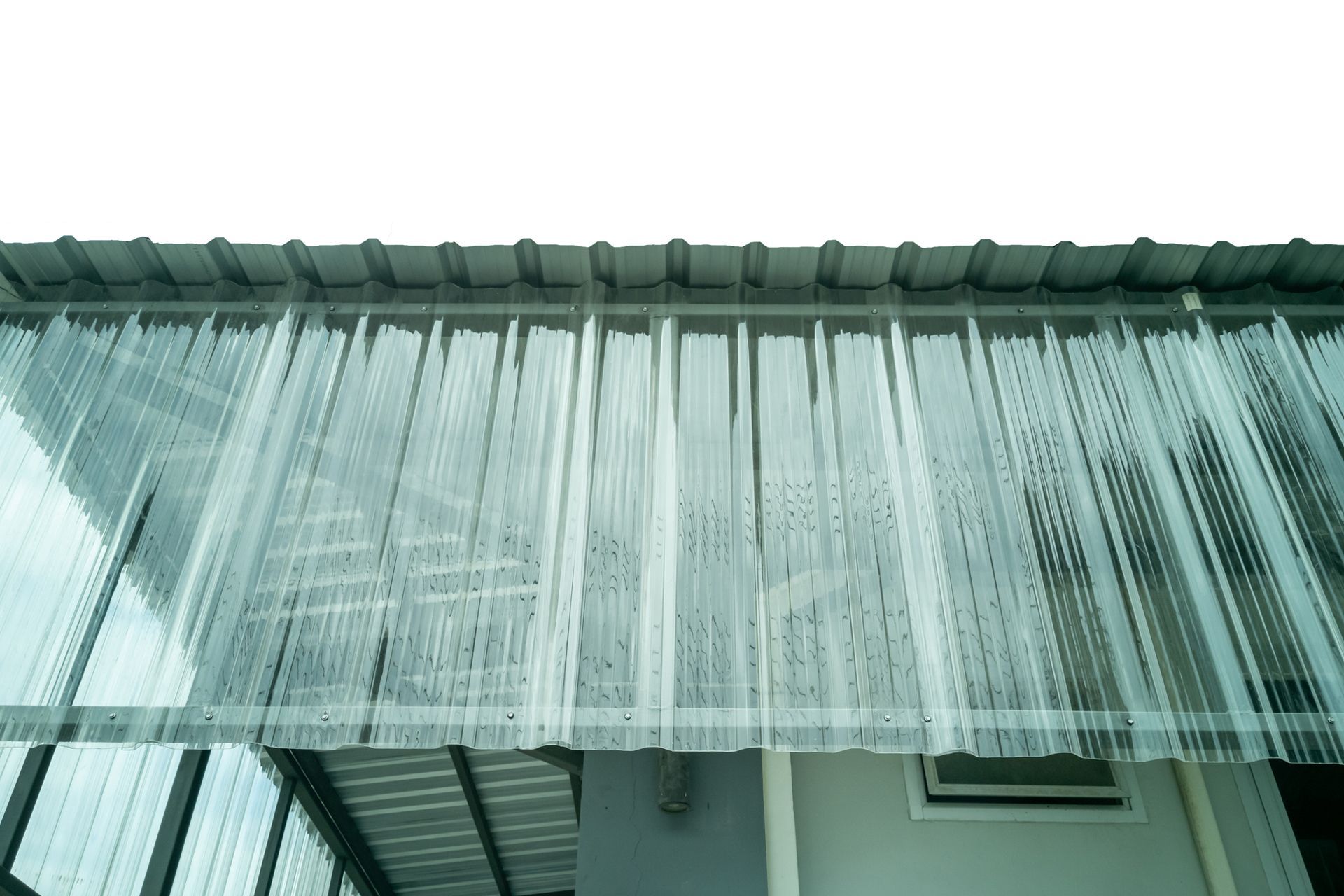 A close up of a clear plastic roof on a building.