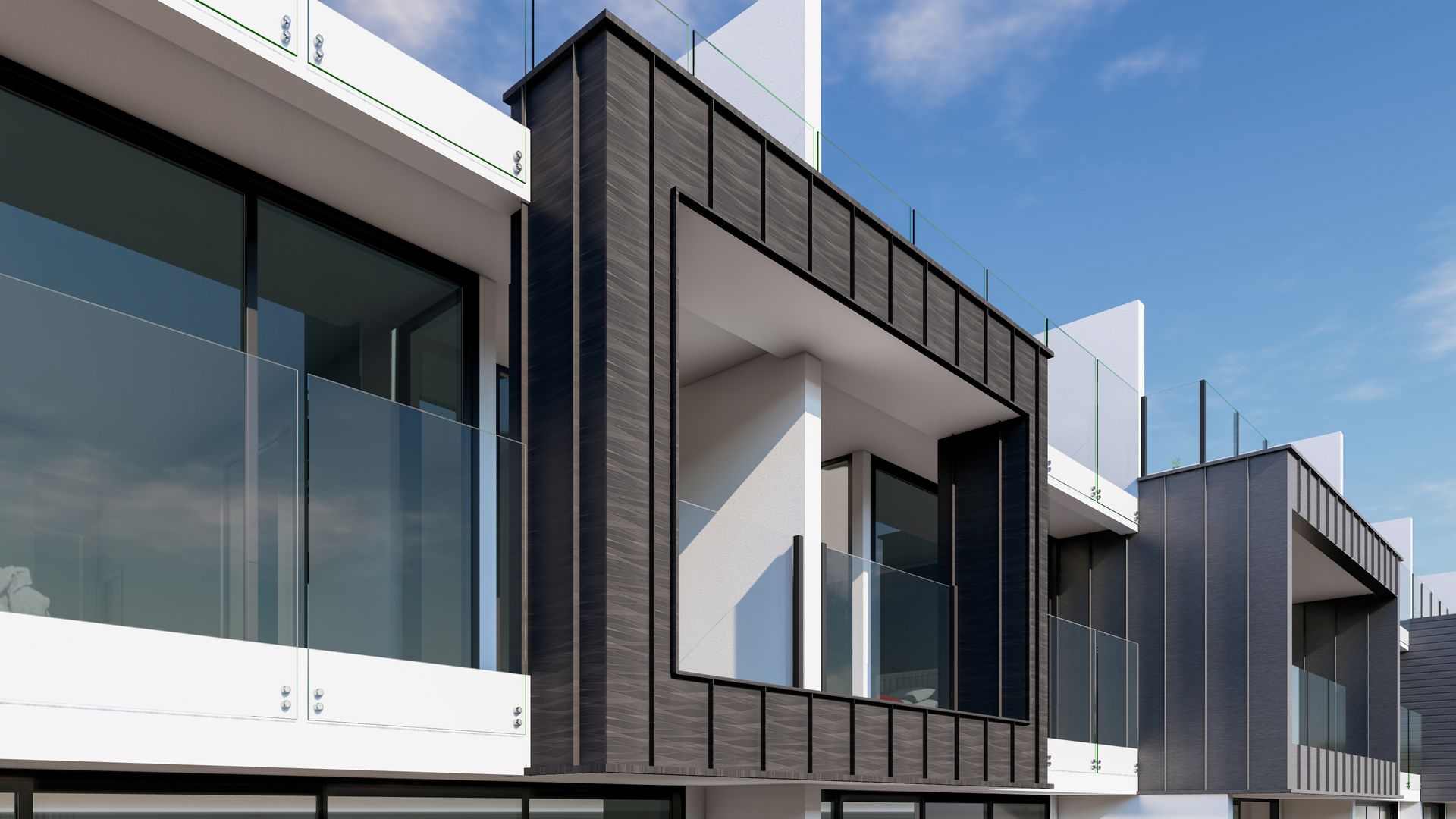 Modern townhouses with dark wood and glass balconies against a blue sky.