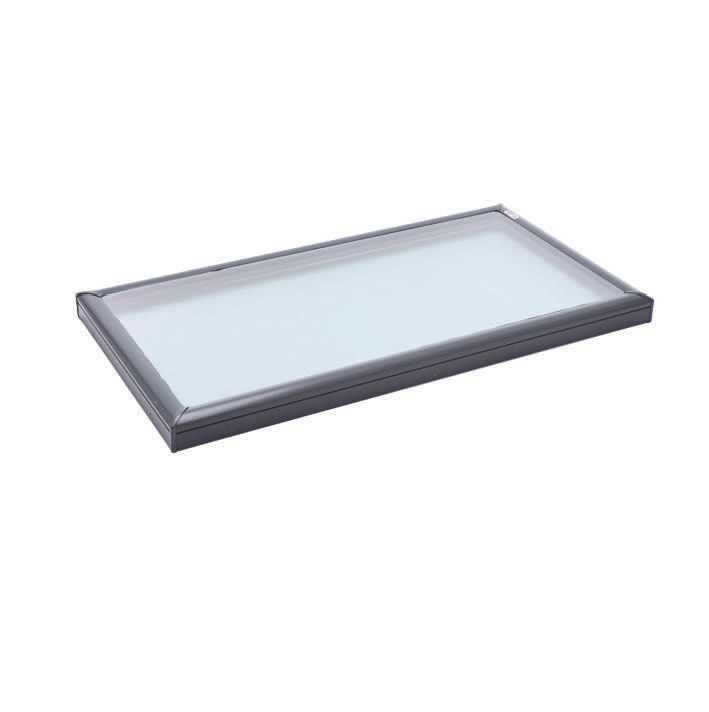 Rectangular skylight with dark frame and clear glass, angled view against a white background.