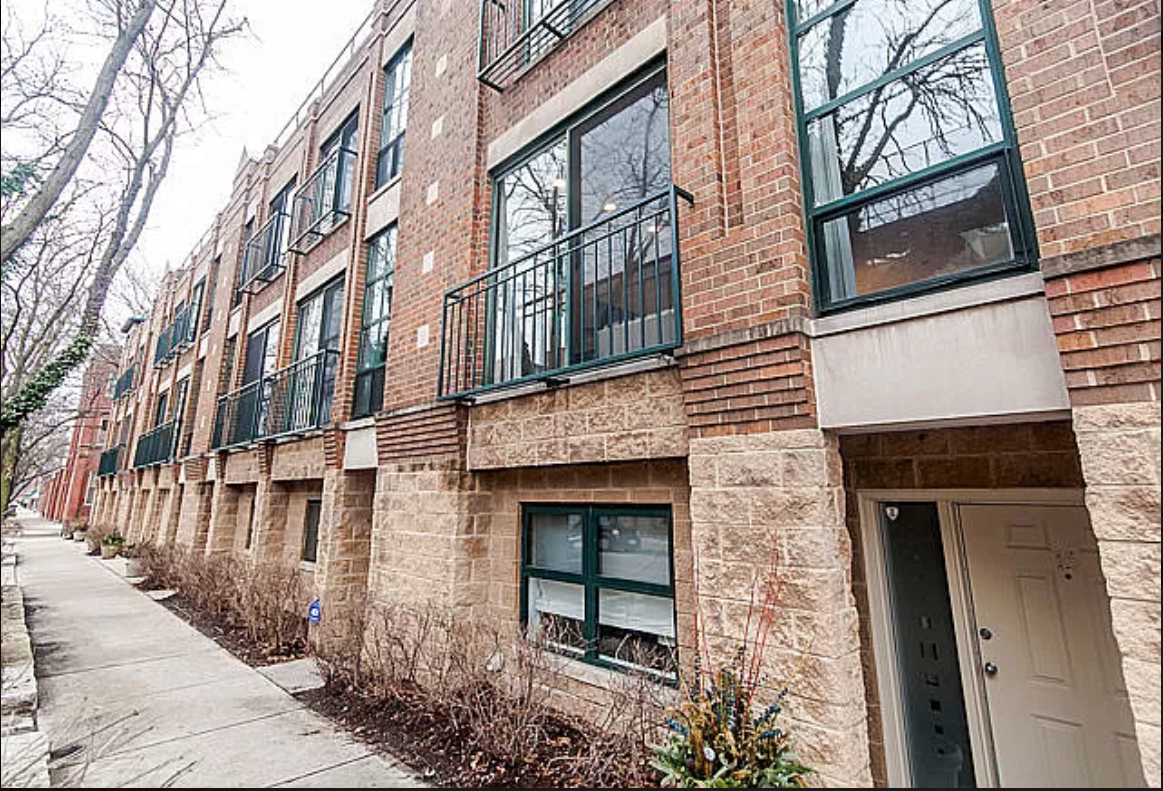 Wet brick and split face block building with Renaissance Stone details Ravenswood, Chicago