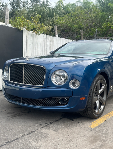a blue Bentley Mulsanne is parked in a parking lot -  In Stock Auto Outlet & Collision