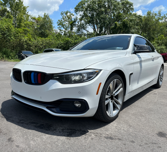 BMW 4 series coupe is parked in a parking lot |  In Stock Auto Outlet and Collision