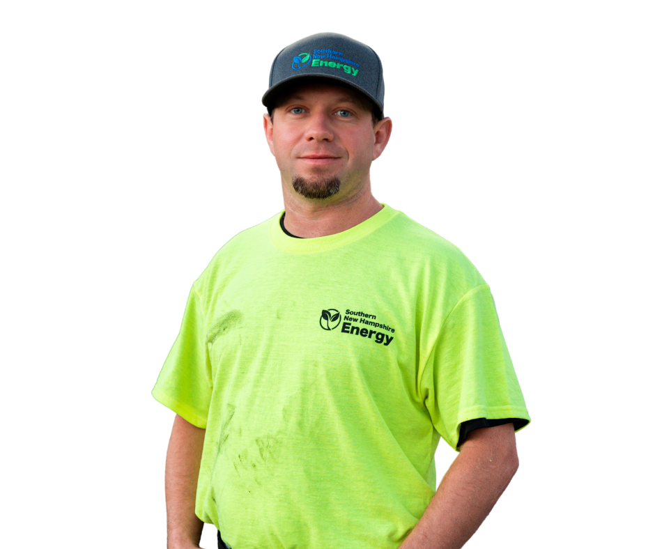 Man wearing a neon green shirt and baseball cap, smiling slightly.