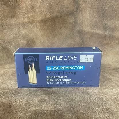 Box of 22-250 Remington rifle ammunition, blue box with bullets pictured, price tag.