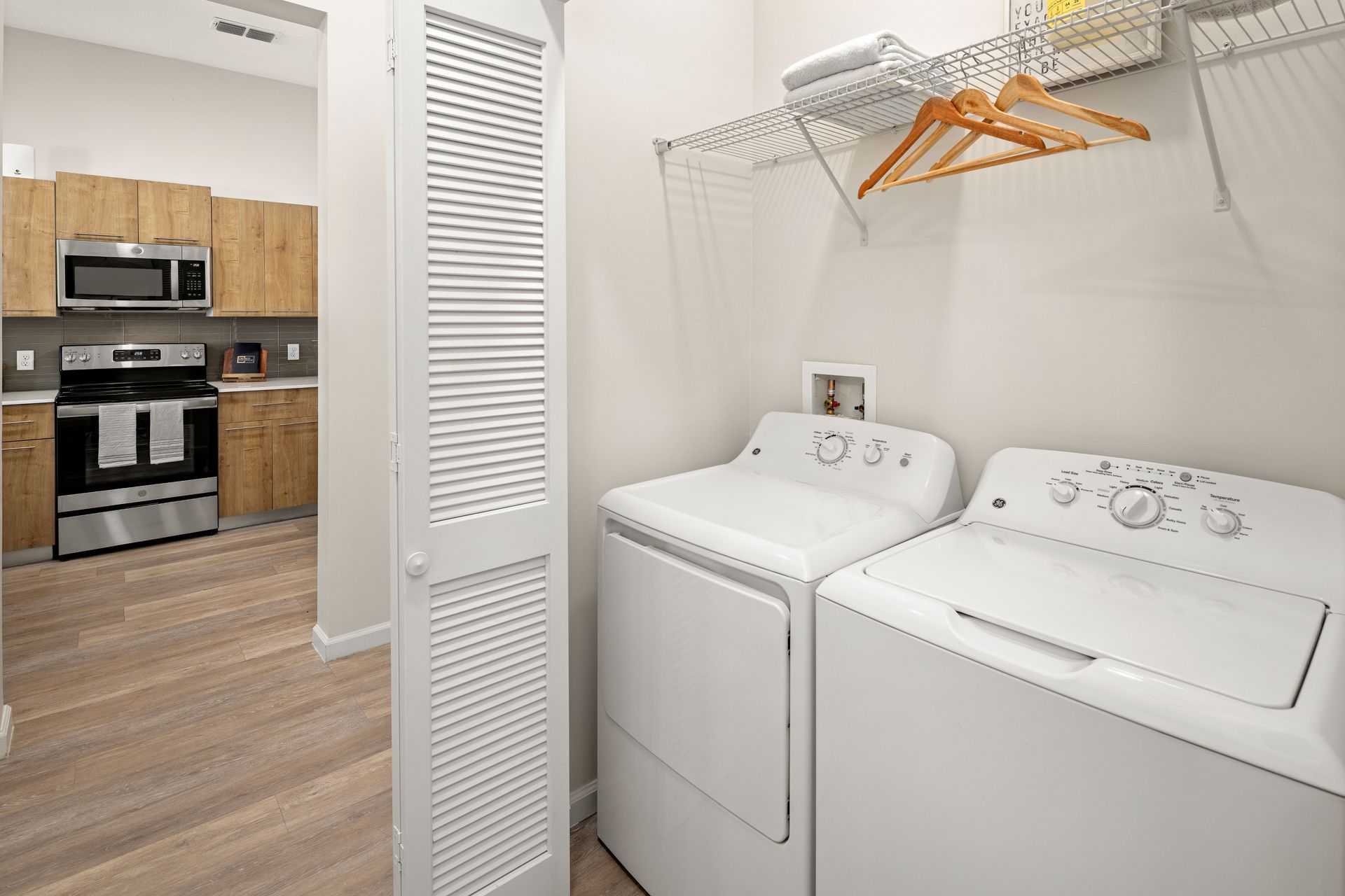 A laundry room with a washer and dryer in it.