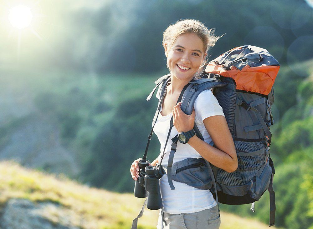 woman backpacking in Yellowtone in the summer