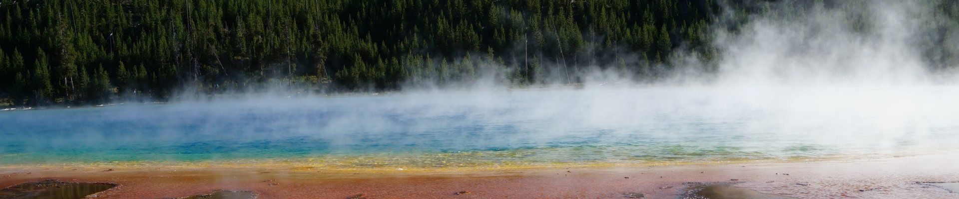 Steam rising from Grand Prismatic at Midway Geyser Basin in Yellowstone National Park