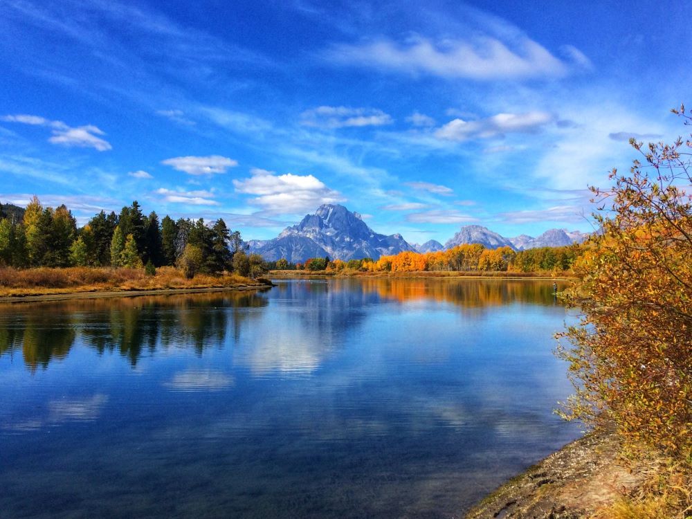 beautiful fall photo of the grand Teton range with the snake river in the foreground