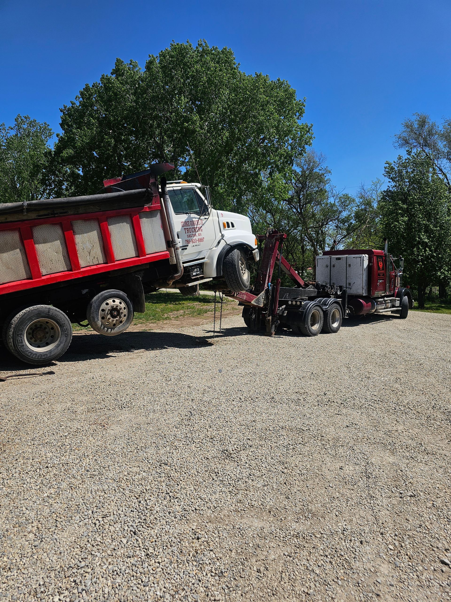 A tow truck is parked on the side of the road