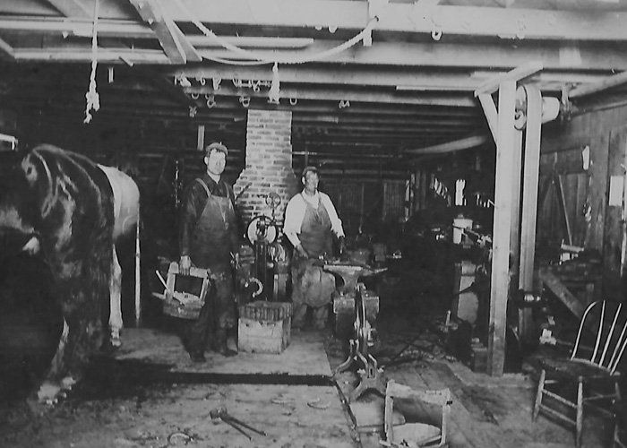 Old Photo of Two Car Workers — Albany, OR — Snyder F L & Son, Inc