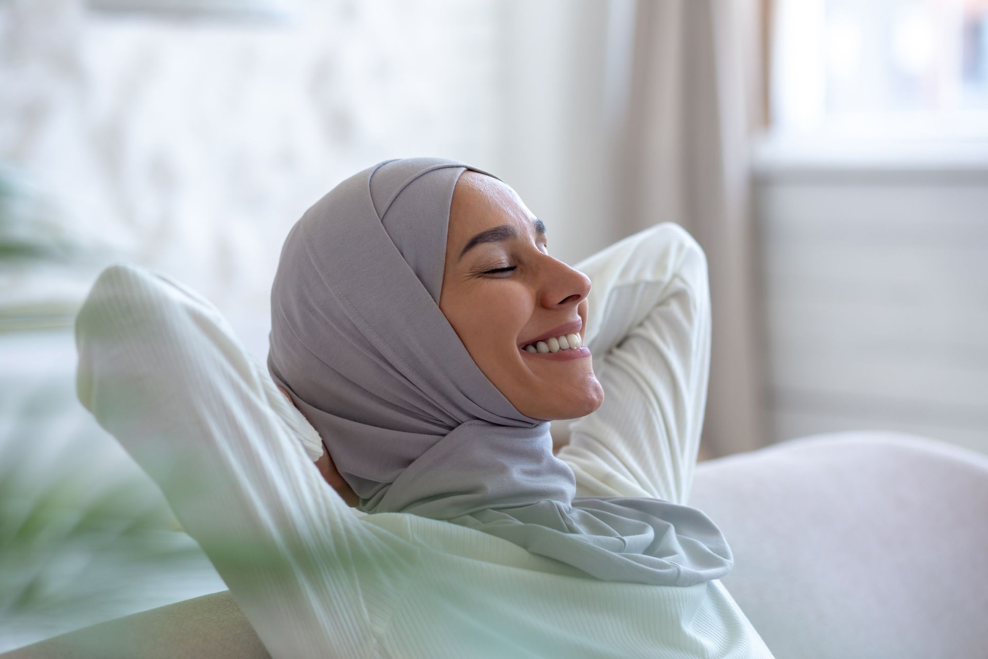 closeup photo smiling muslim young woman