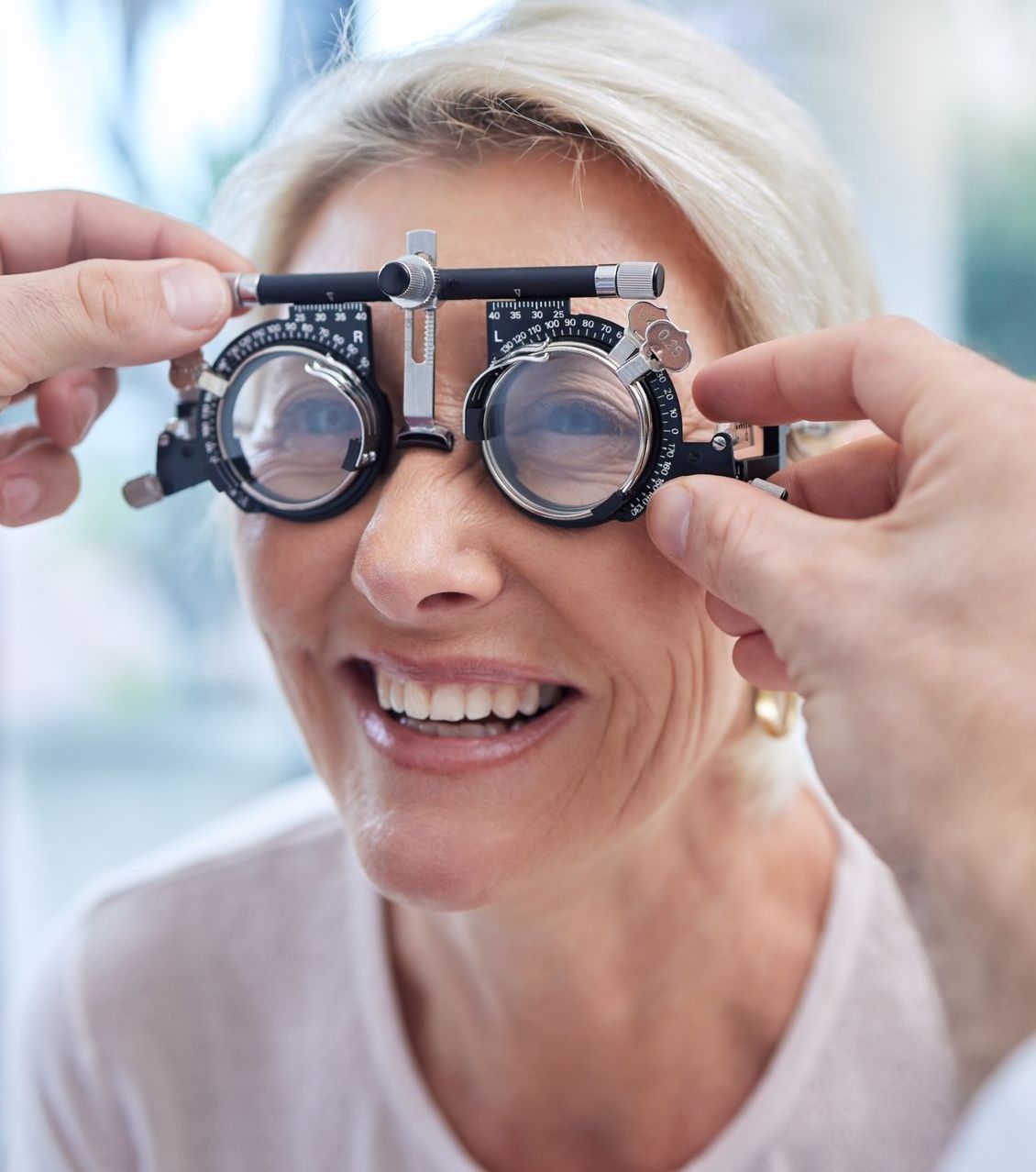 happy customer in vision test or eye exam