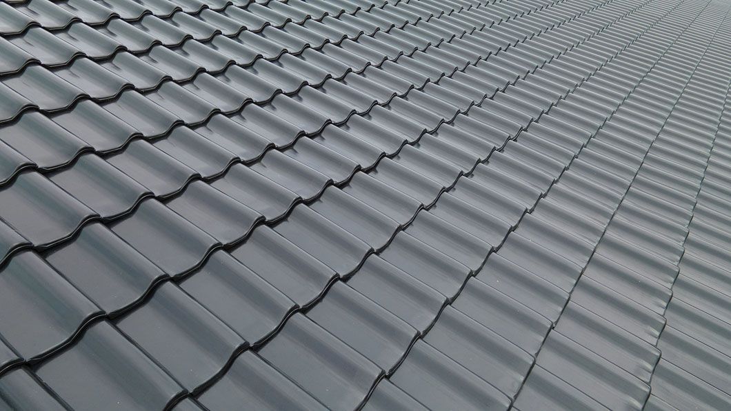 An aerial view of a gray tiled roof.