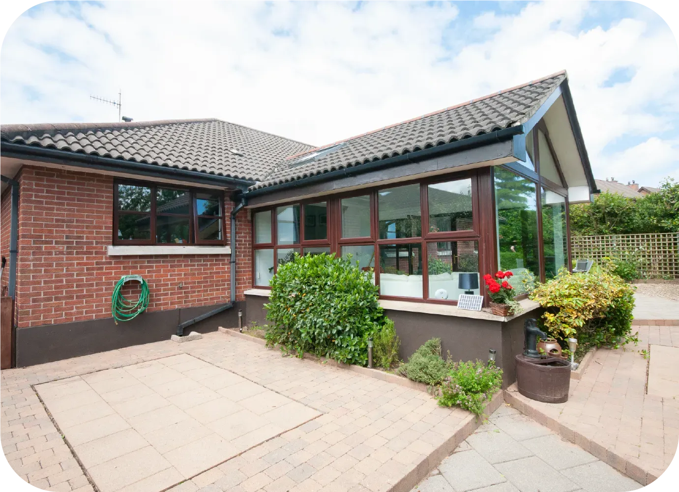 A man is working on the side of a building with a crane.