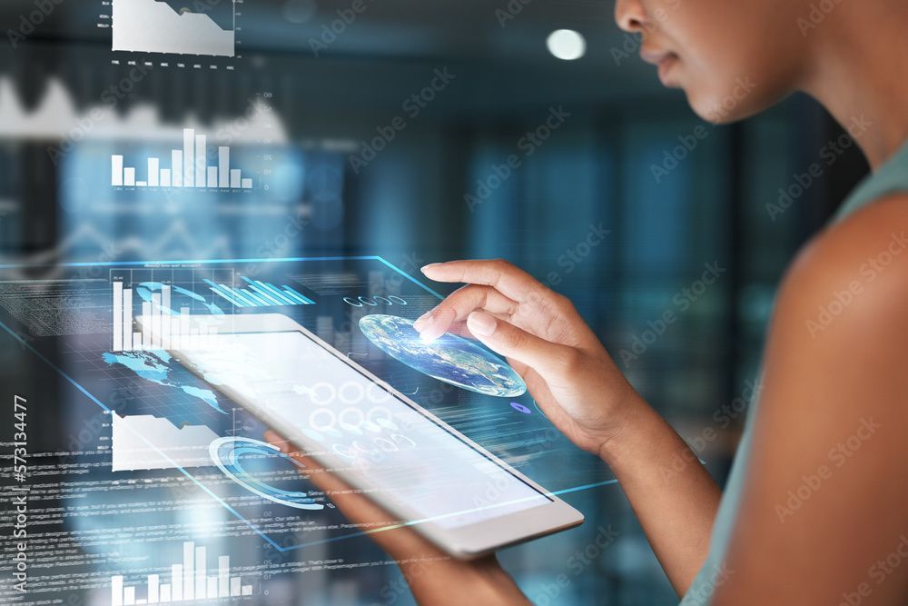 A woman is using a tablet computer with a futuristic screen.