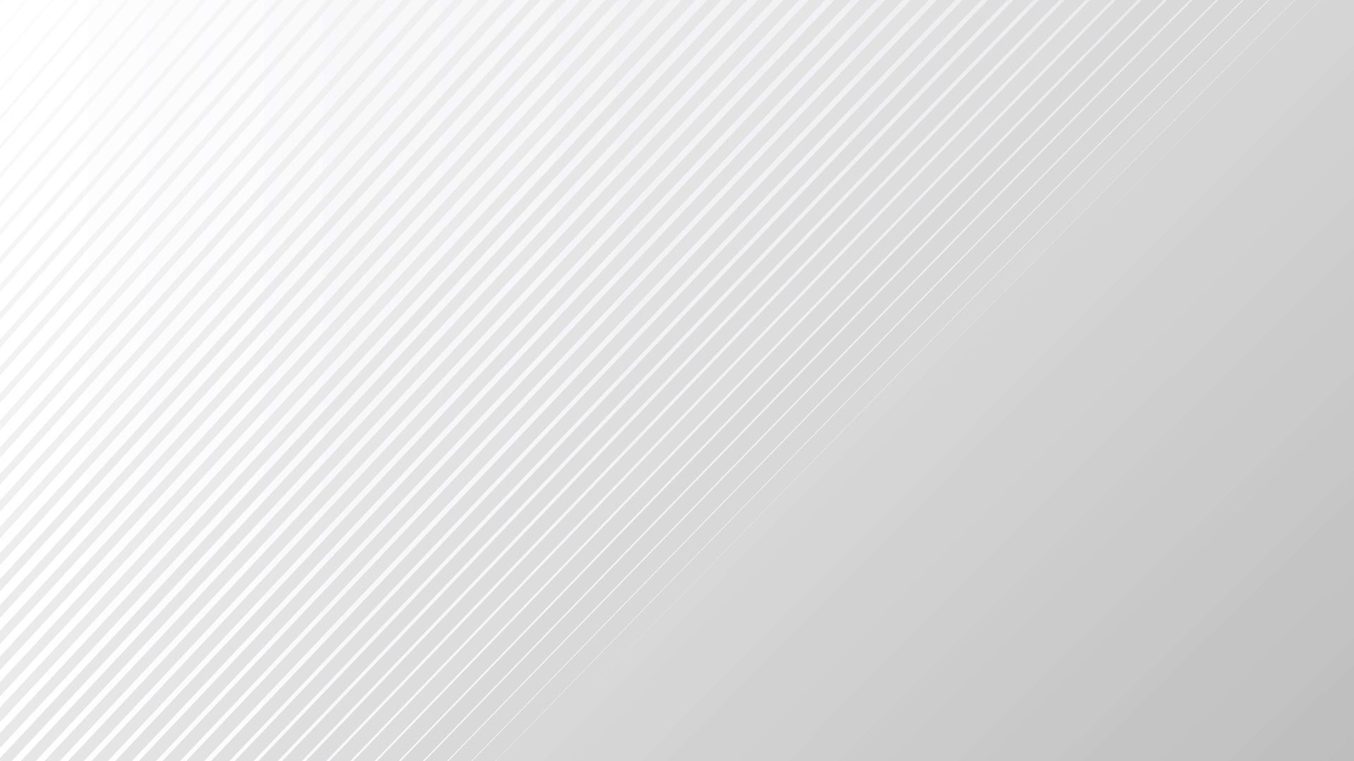 Man pointing, smiling, wearing black hoodie; arm tattoo visible.