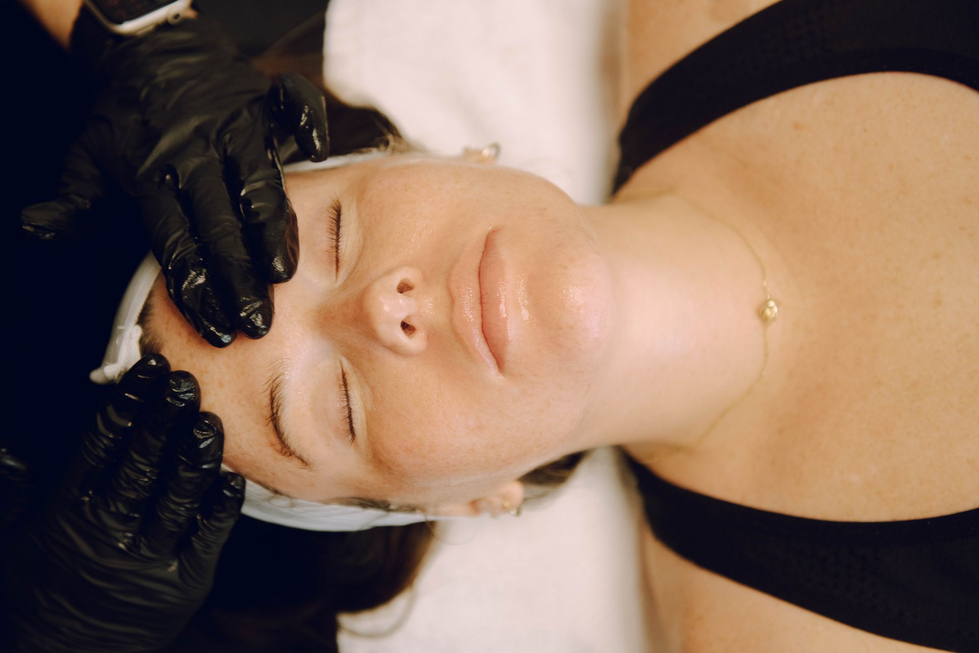 A Woman is Getting a Facial Treatment at a Spa — Auburndale, FL — Ultra Cryo & Recovery