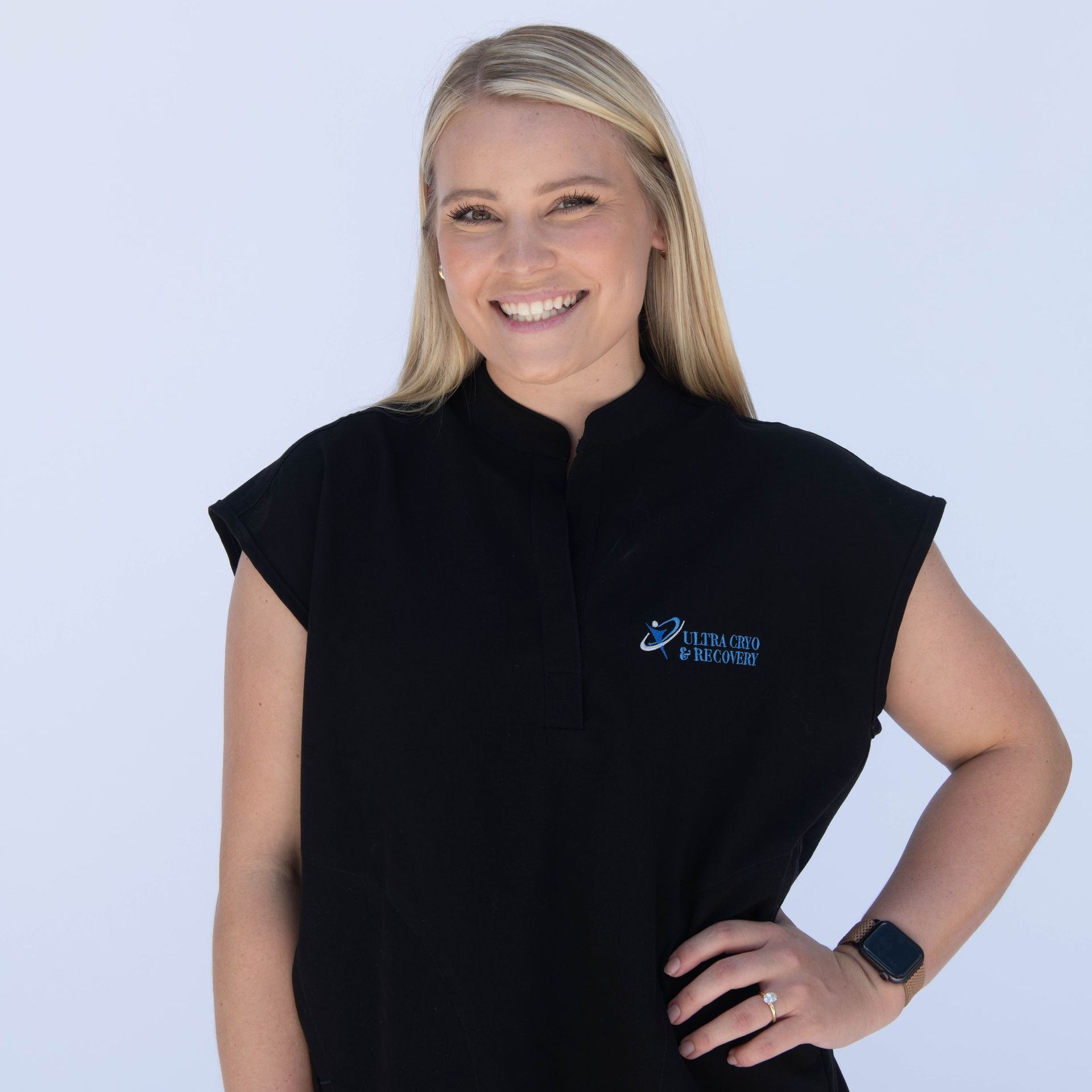 A woman wearing a black shirt that says ' sydney ' on it