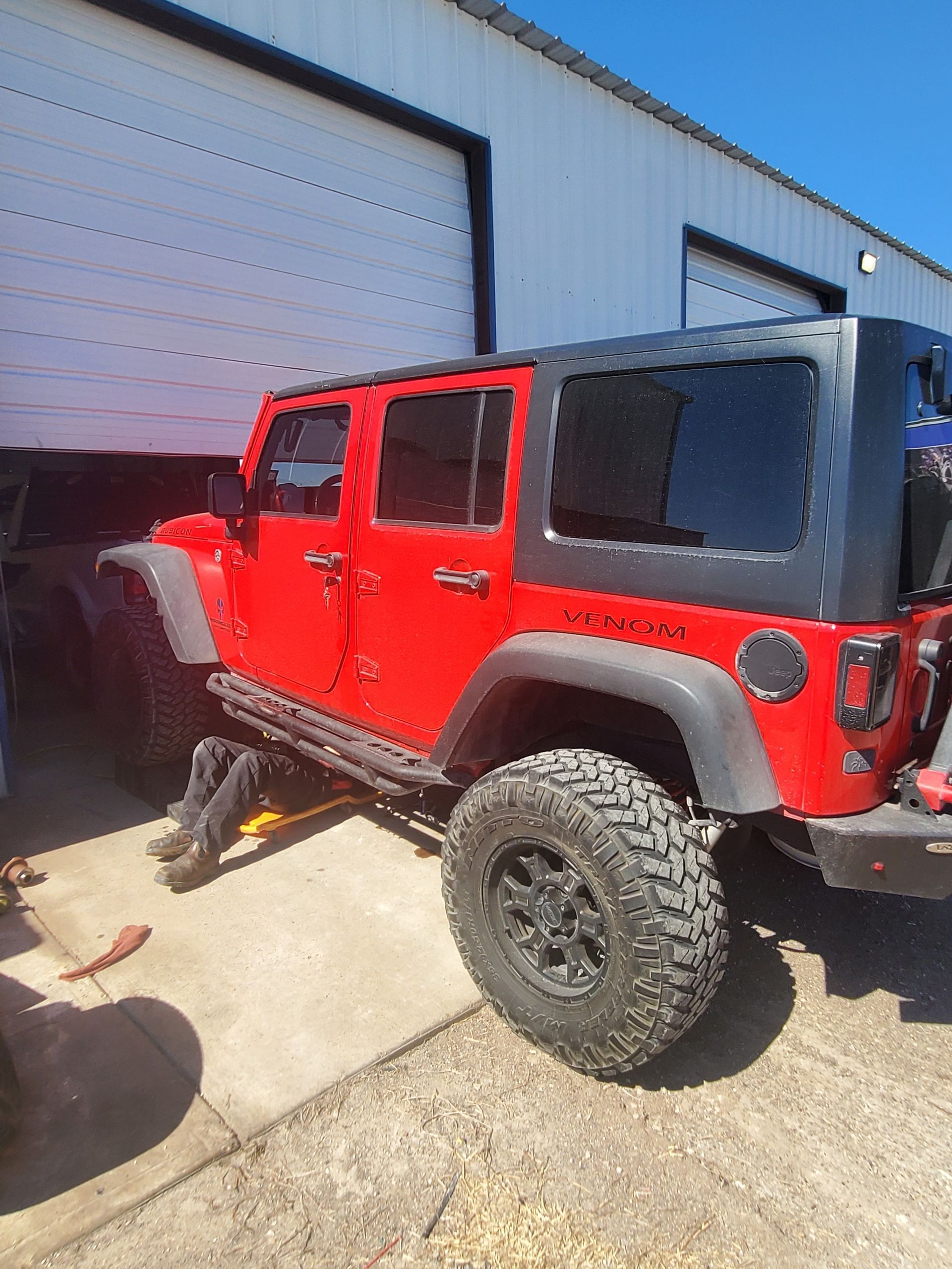 Image file 1 of our technicians, Jason, working on the suspension of this Jeep Wrangler-