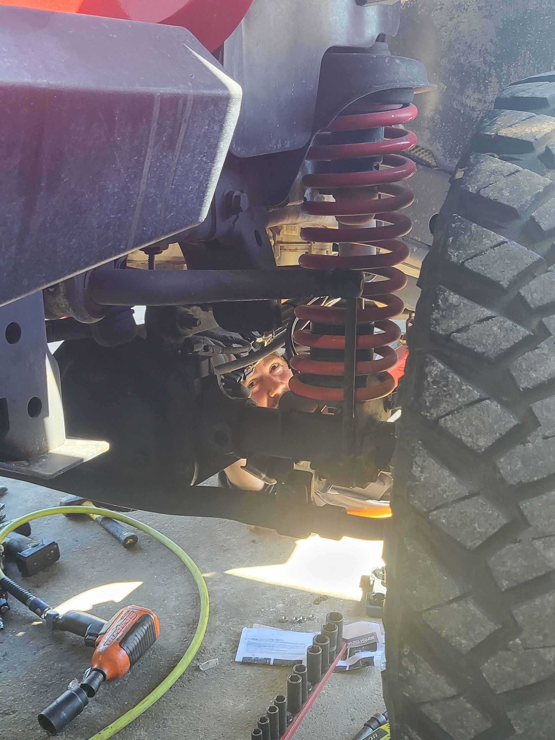 One of our technicians, Jason, working on the suspension of this Jeep Wrangler