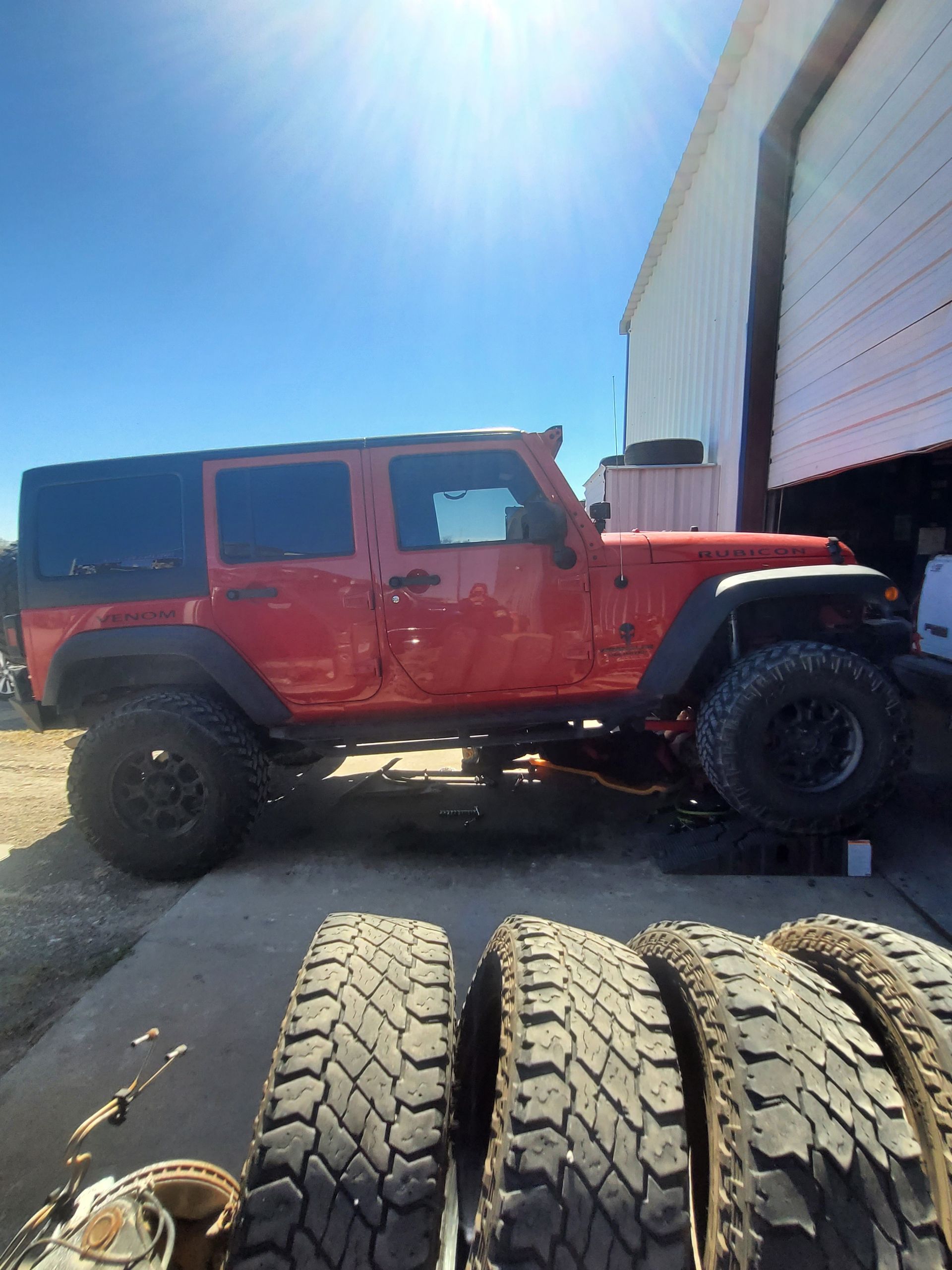 One of our technicians, Jason, working on the suspension of this Jeep Wrangler