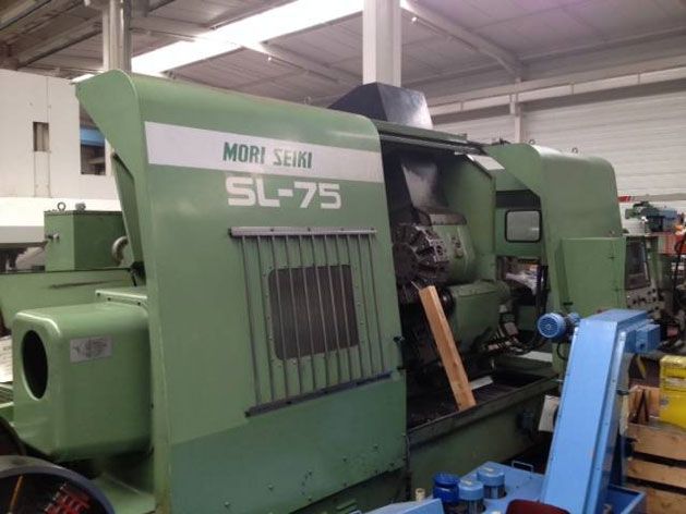 A green machine with the number 75 on it