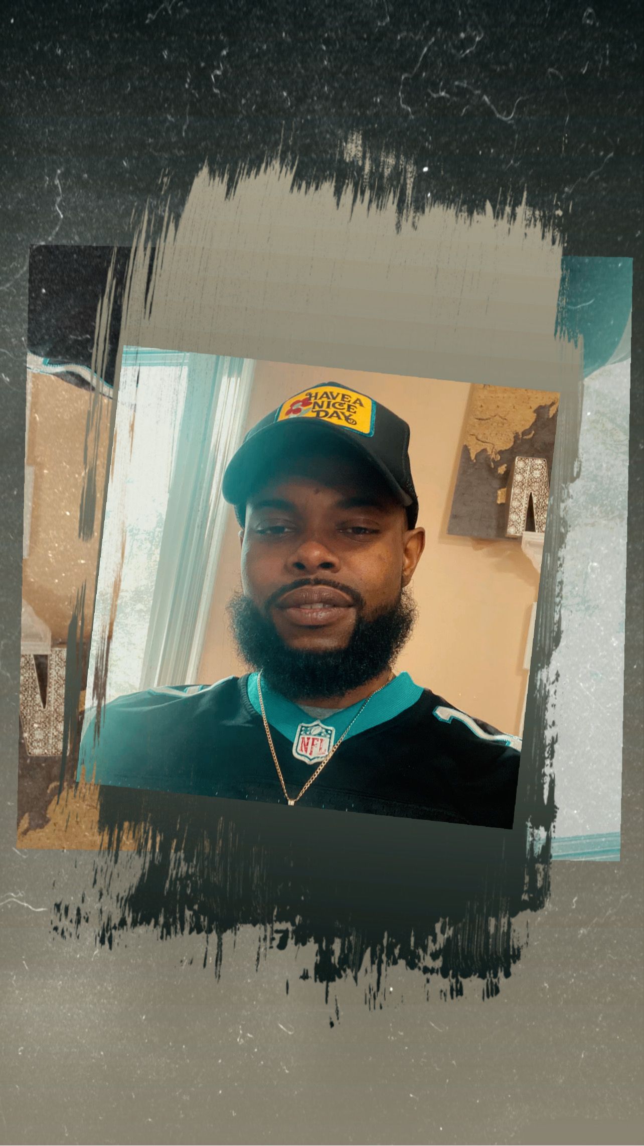 Man in Jaguars gear smiles, teal and black colors. Inside abstract frame.