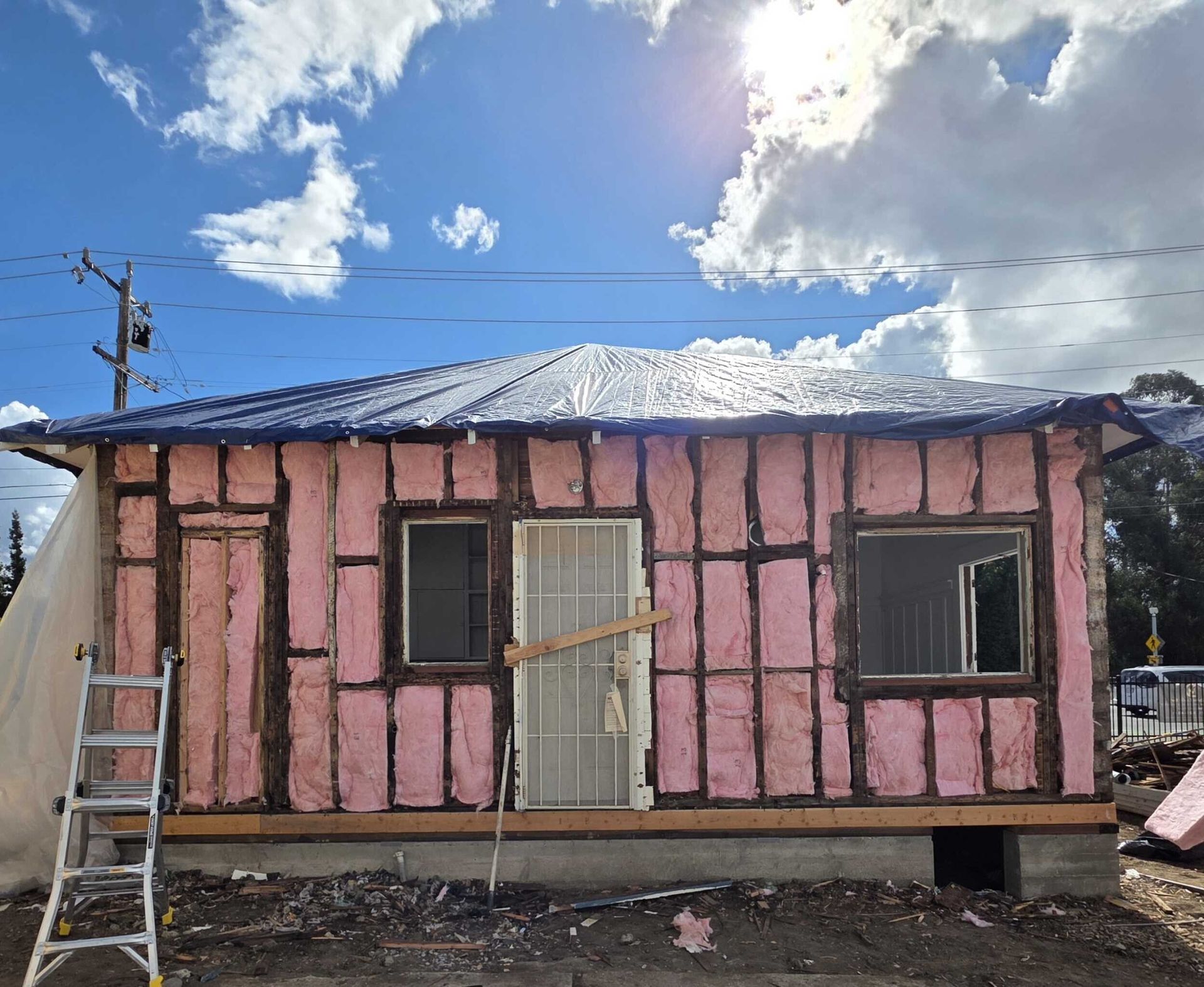 Complete exterior siding renovation featuring removal of deteriorated wood siding, structural repairs, new weather-resistant barrier installation, fiber cement lap siding, upgraded trim details, new gutters and downspouts, and energy-efficient window updates. Exterior remodel completed by Dream Build Services, specializing in siding replacement, home exterior upgrades, structural repairs, and residential renovations in the Bay Area.