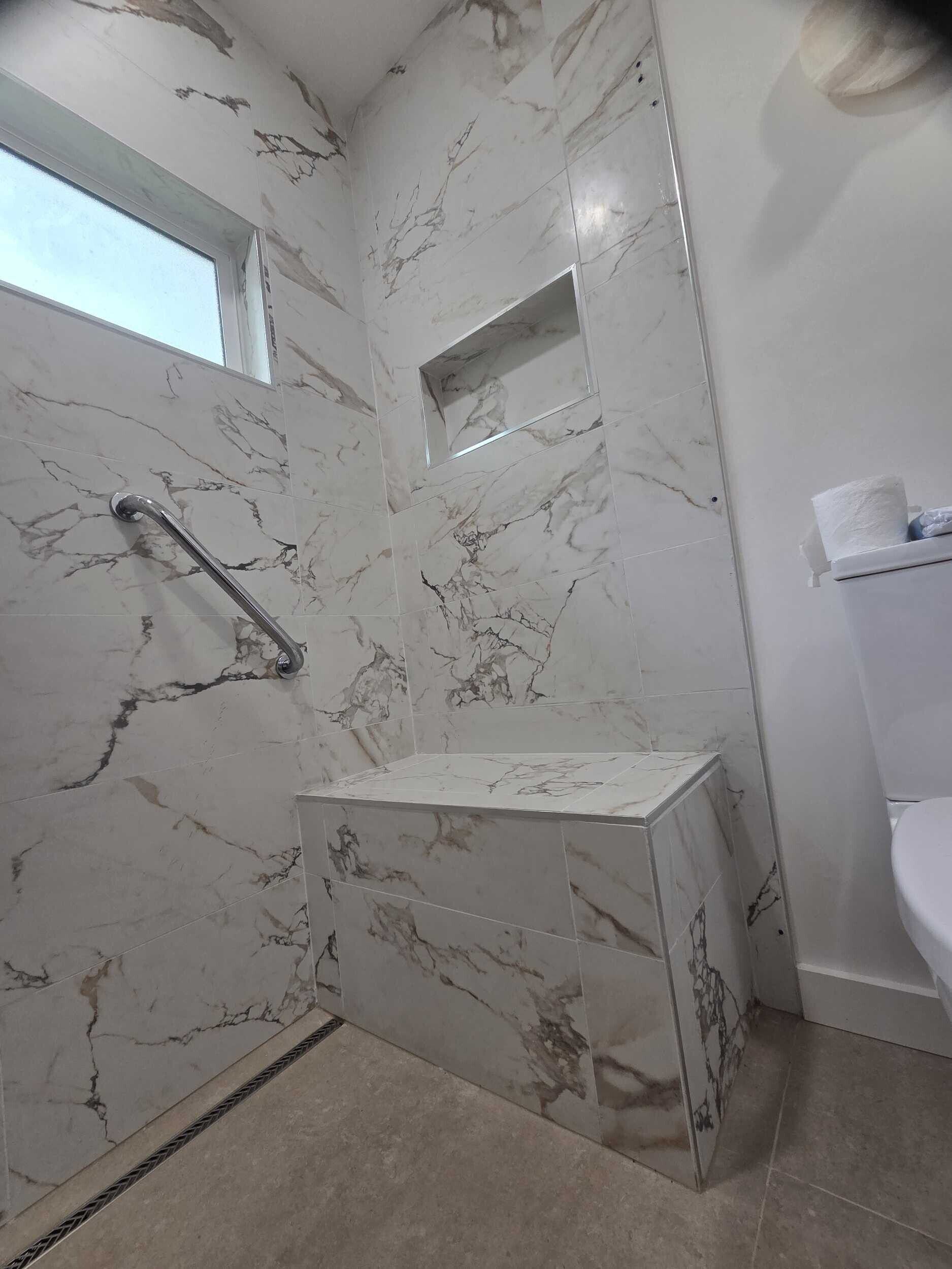 Dream Build Services recently completed an accessible bathroom renovation in the Bay Area, transforming an outdated and narrow layout into a modern, mobility-friendly space. The remodel features a spacious walk-in shower with grab bars, a built-in bench, modern lighting, and sleek tile design. Ideal for aging-in-place, senior accessibility, and improved home safety.