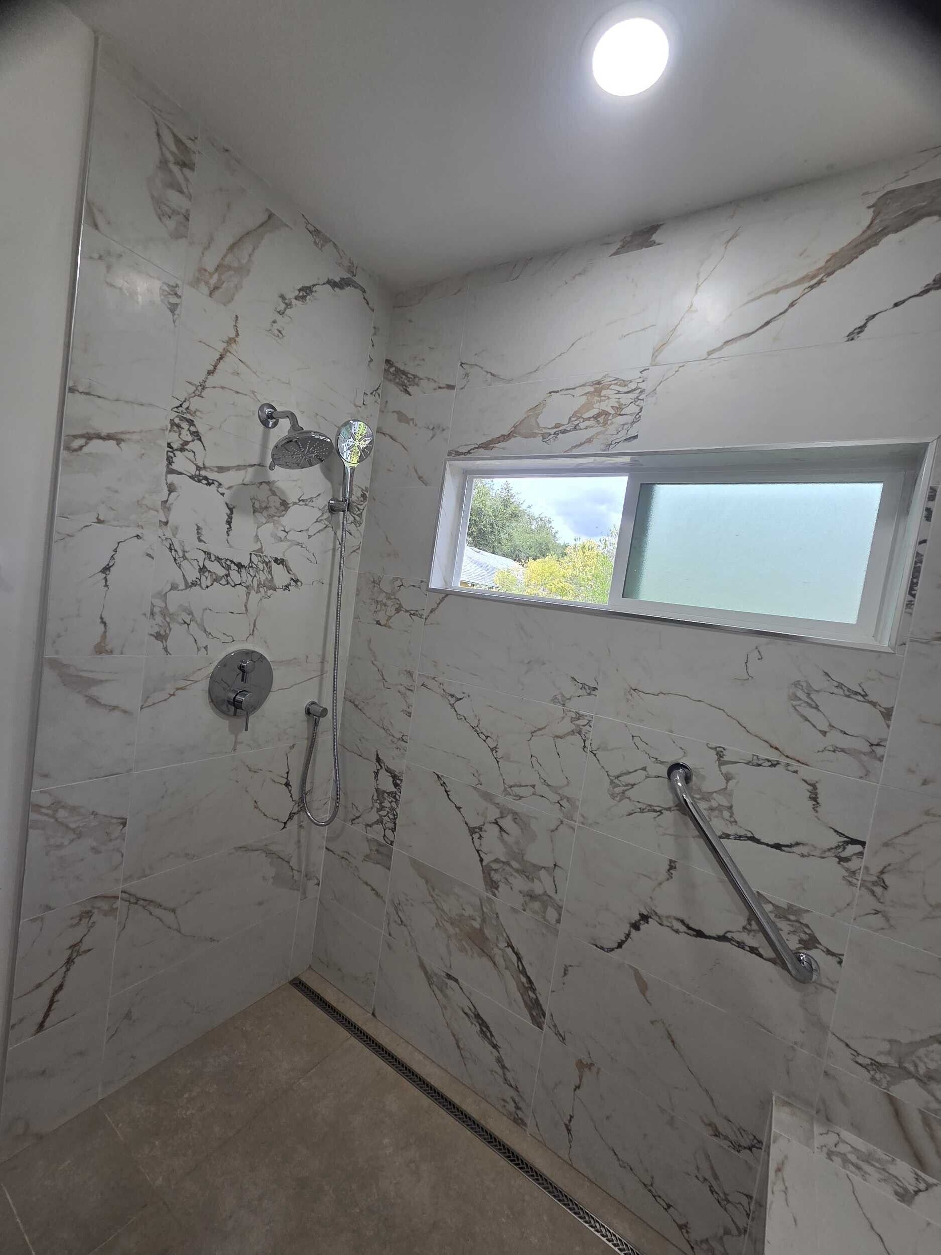 Dream Build Services recently completed an accessible bathroom renovation in the Bay Area, transforming an outdated and narrow layout into a modern, mobility-friendly space. The remodel features a spacious walk-in shower with grab bars, a built-in bench, modern lighting, and sleek tile design. Ideal for aging-in-place, senior accessibility, and improved home safety.