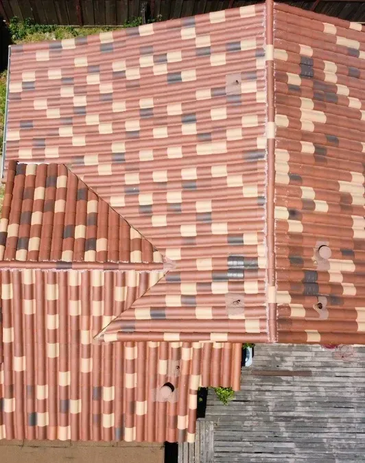 An aerial view of a house with a tiled roof.