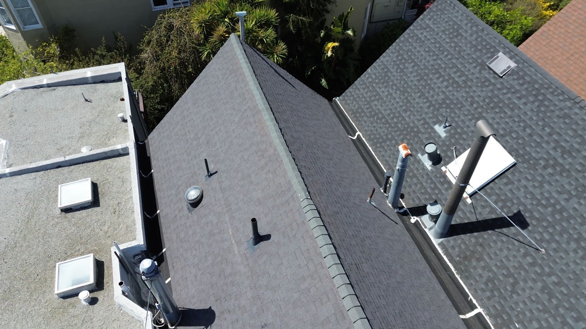 An aerial view of a roof with a chimney on it.