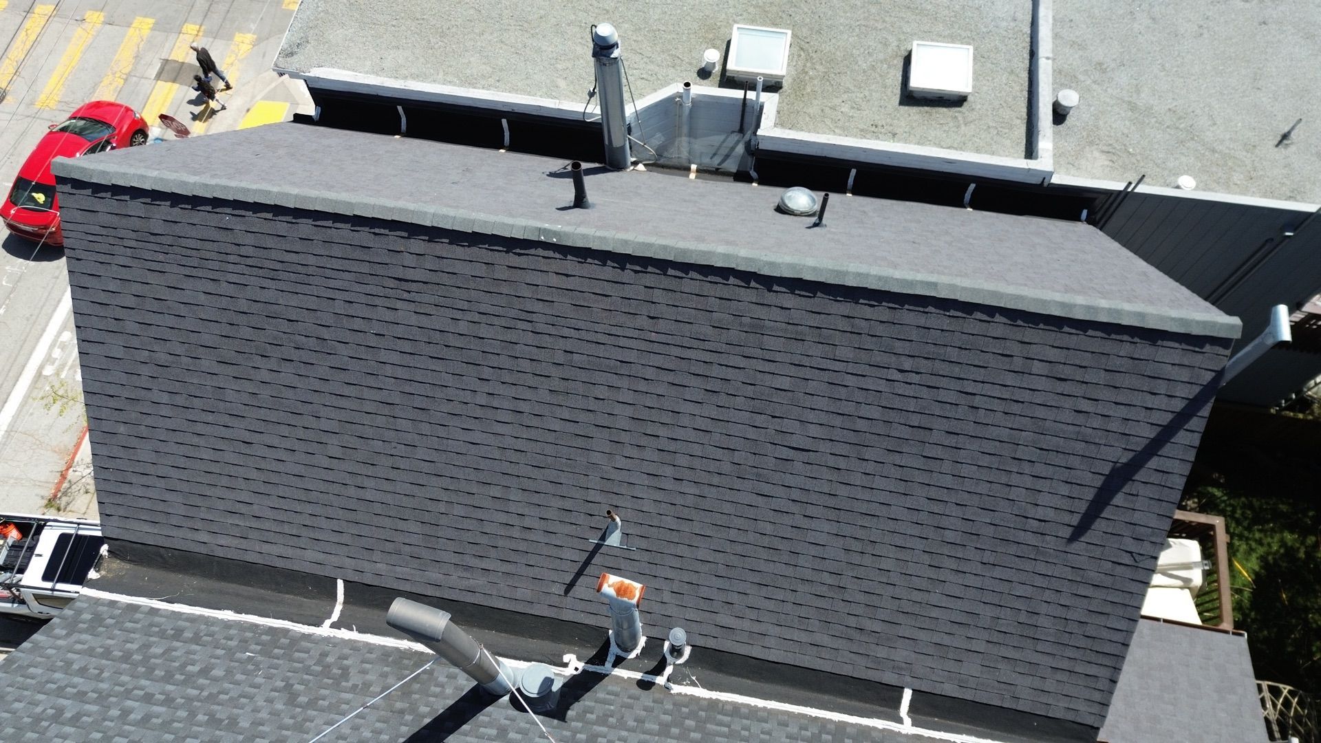 An aerial view of a roof with a chimney on it