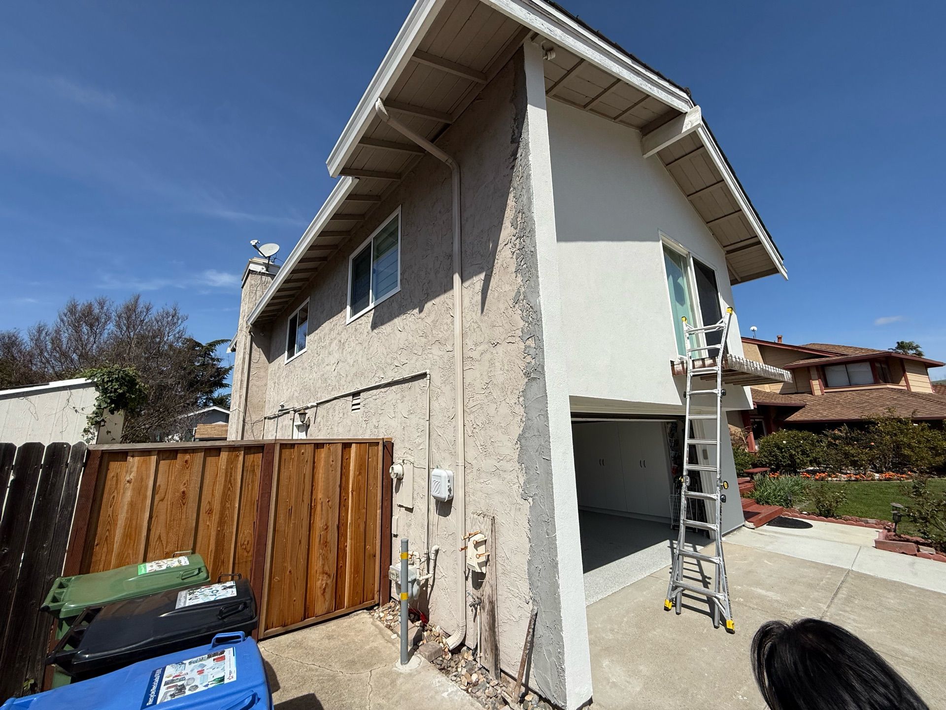 A house with a ladder on the side of it