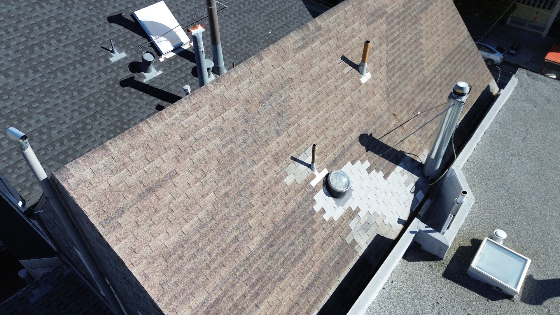 An aerial view of a roof with a hole in it.