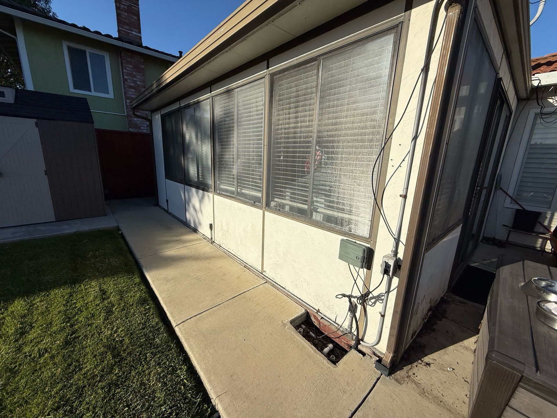A house with a lot of windows and a walkway