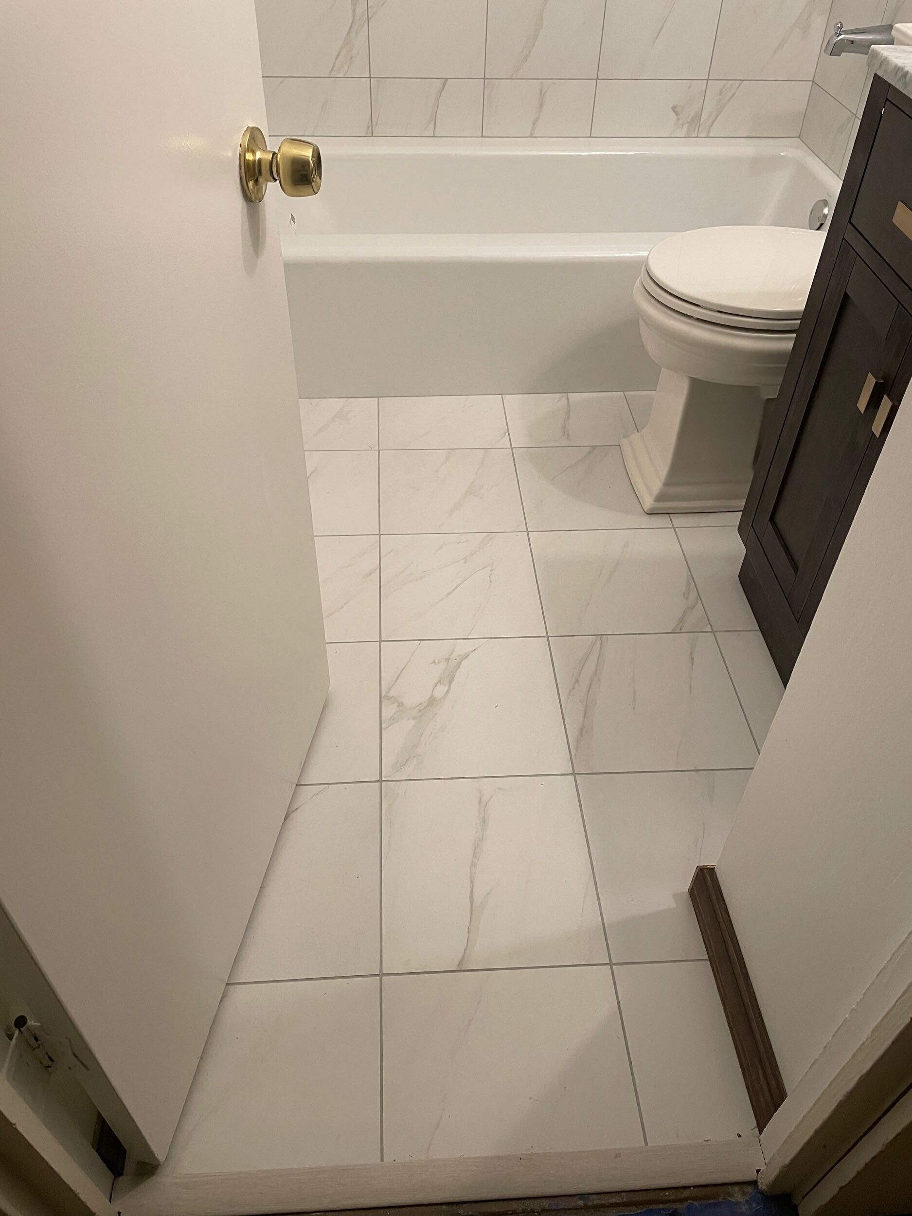 This bathroom remodel by Dream Build Services showcases a complete transformation from an outdated design to a modern, elegant space. The renovation included new marble-look wall and floor tiles, a sleek vanity with upgraded hardware, energy-efficient lighting, and modern plumbing fixtures. The result is a brighter, cleaner, and more functional bathroom that blends comfort and contemporary style. Located in the Bay Area, Dream Build Services specializes in bathroom remodels, home renovations, and functional design improvements.