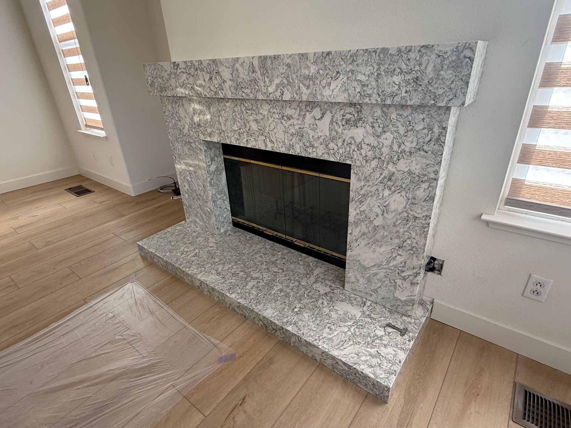 There is a fireplace in the middle of the room.