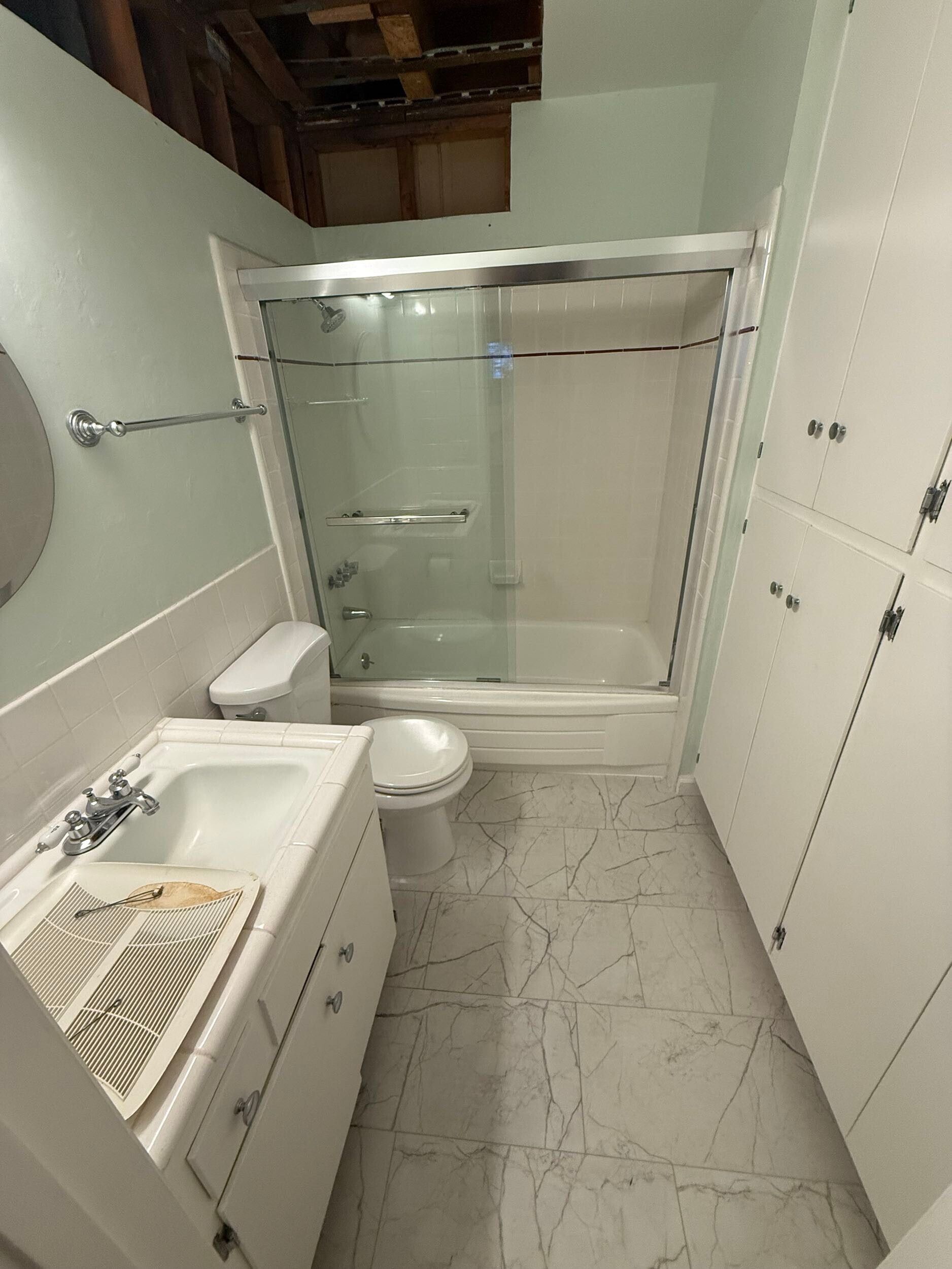 Dream Build Services delivered a full bathroom renovation in the Bay Area, upgrading an outdated bath into a sophisticated modern retreat. The project included new tile installation with marble patterns, a custom walk-in shower with glass doors and chrome fixtures, updated vanity cabinetry, and improved lighting for a brighter, more inviting space. This remodel combines functionality with elegant design, reflecting Dream Build Services’ commitment to quality craftsmanship and comfort.