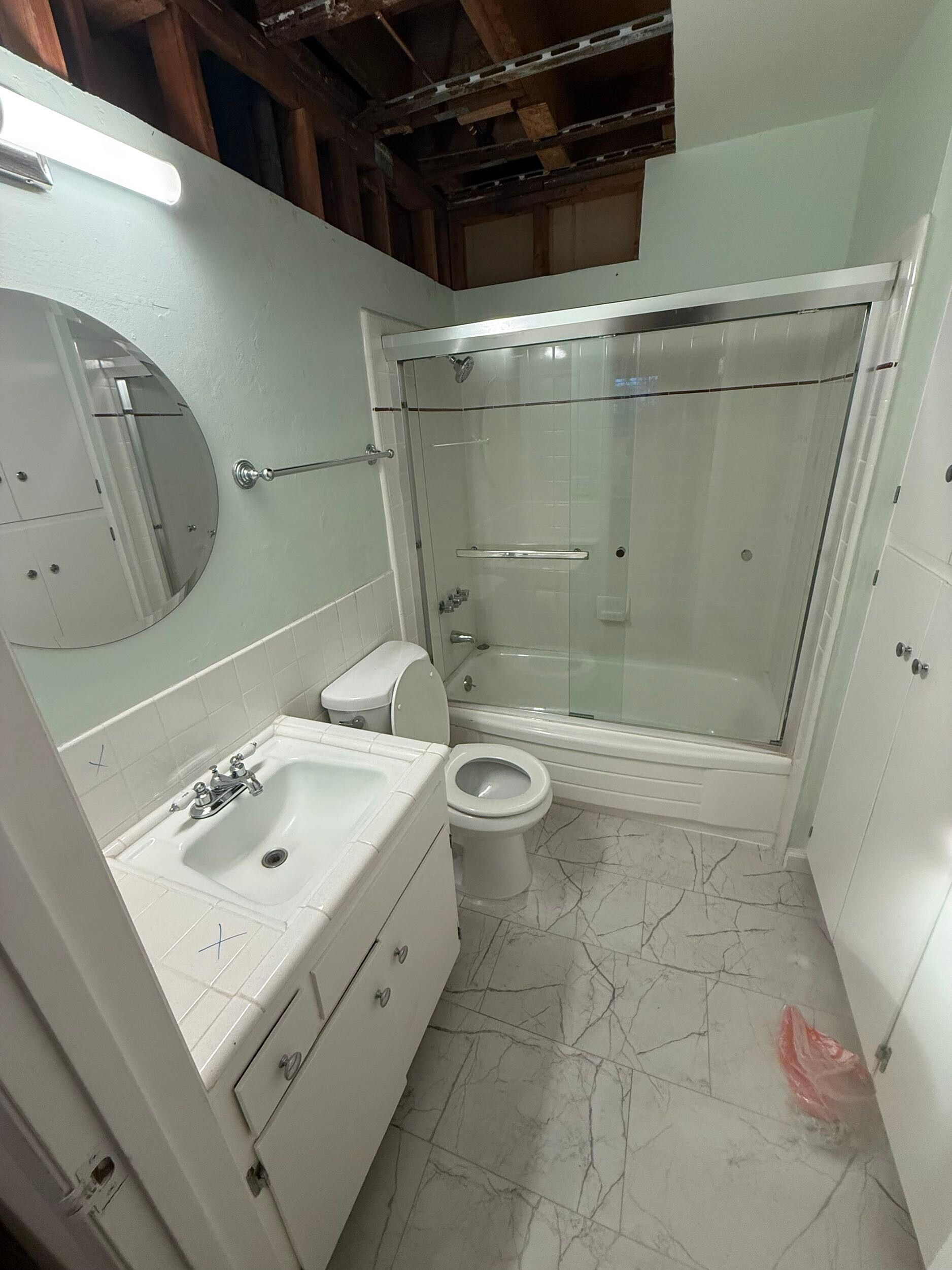 Dream Build Services delivered a full bathroom renovation in the Bay Area, upgrading an outdated bath into a sophisticated modern retreat. The project included new tile installation with marble patterns, a custom walk-in shower with glass doors and chrome fixtures, updated vanity cabinetry, and improved lighting for a brighter, more inviting space. This remodel combines functionality with elegant design, reflecting Dream Build Services’ commitment to quality craftsmanship and comfort.