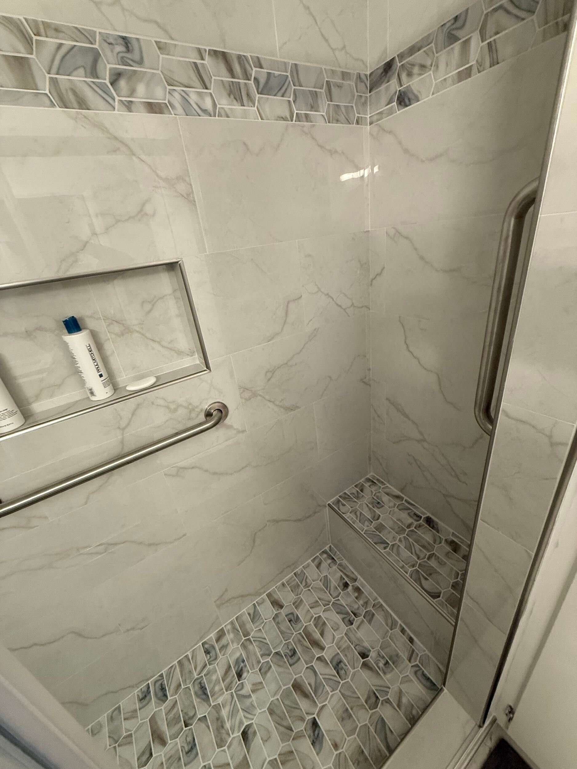 Dream Build Services delivered a full bathroom renovation in the Bay Area, upgrading an outdated bath into a sophisticated modern retreat. The project included new tile installation with marble patterns, a custom walk-in shower with glass doors and chrome fixtures, updated vanity cabinetry, and improved lighting for a brighter, more inviting space. This remodel combines functionality with elegant design, reflecting Dream Build Services’ commitment to quality craftsmanship and comfort.