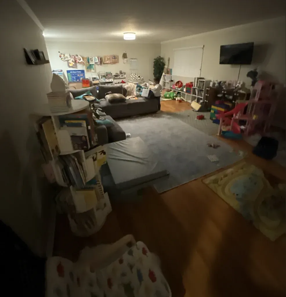A living room filled with lots of furniture and toys.