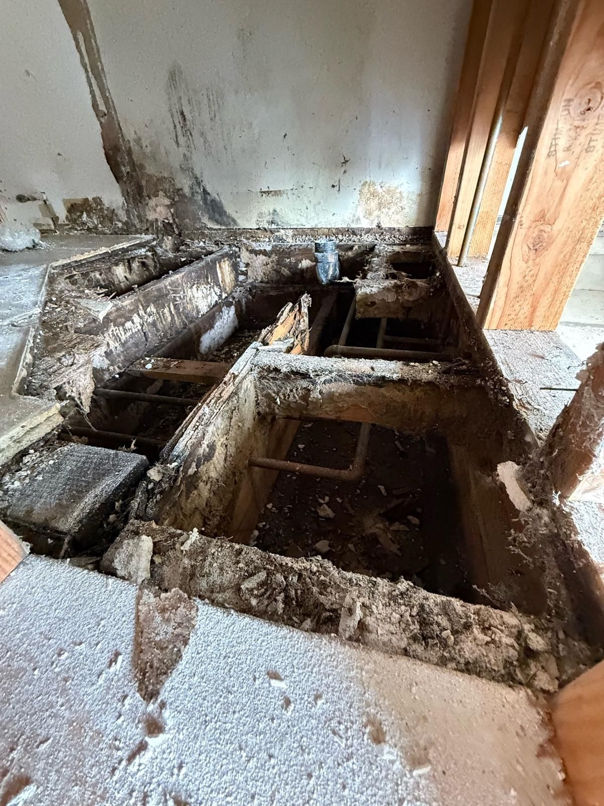 There is a hole in the floor of a building.