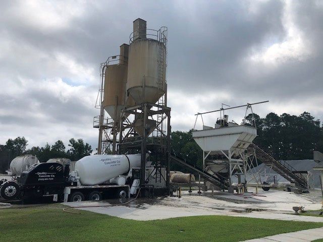 concrete truck pouring fresh concrete