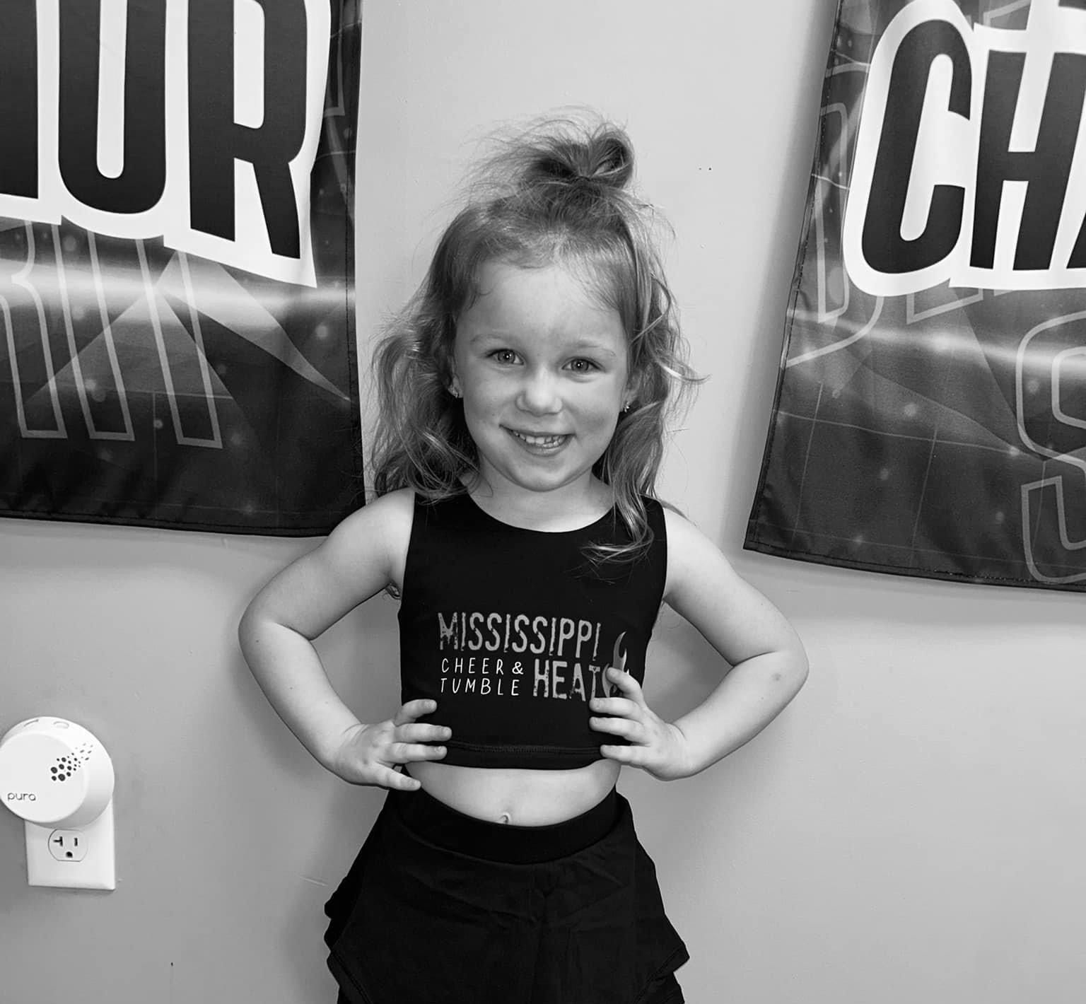 A little girl wearing a mississippi heart health crop top