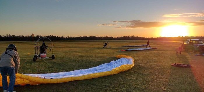 paramotors on the field sunrise view