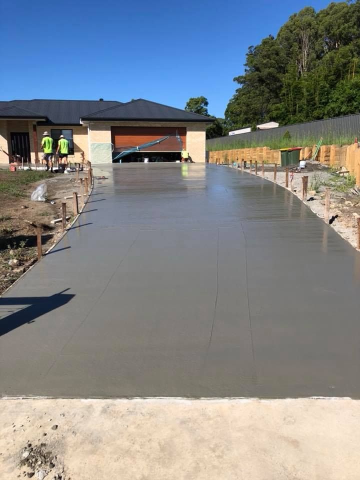A Concrete Driveway Is Being Built In Front Of A House — Luke Seears Concreting in Laurieton, NSW