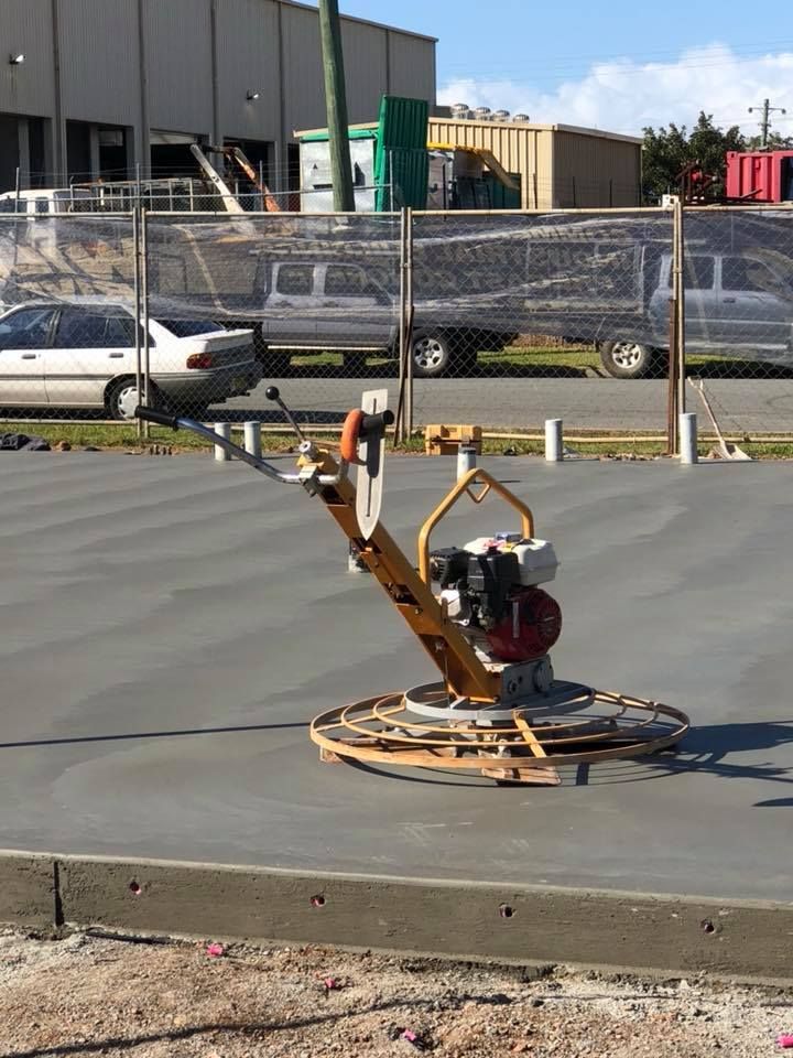 A Machine Is Sitting On Top Of A Concrete Surface — Luke Seears Concreting in Laurieton, NSW
